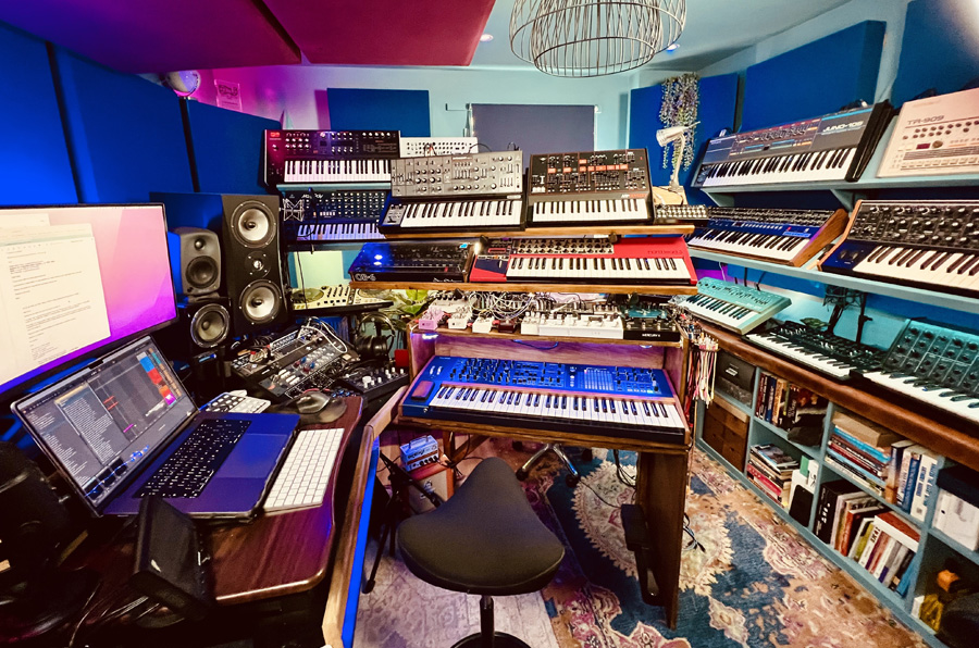 D. Ramirez's music studio, with multiple electronic keyboards.