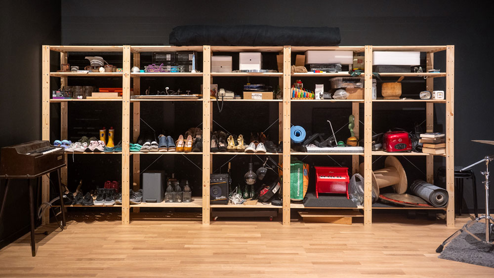 Shelves of various everyday objects used in film sound creation.